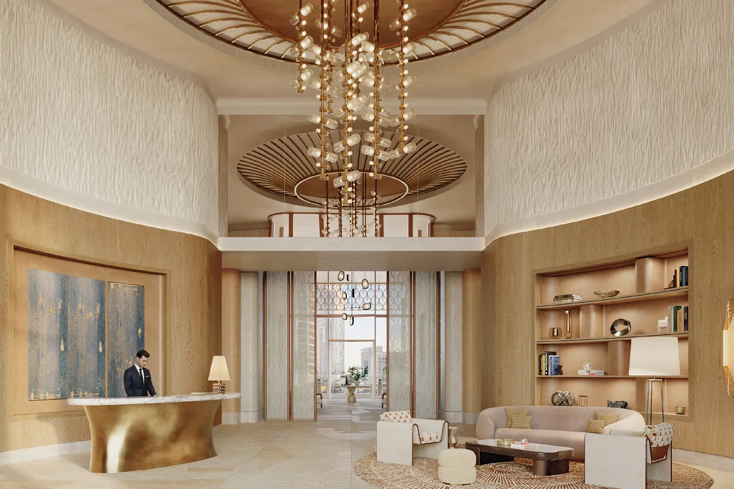 Double-height lobby with sculptural chandelier, concierge desk and lounge seating