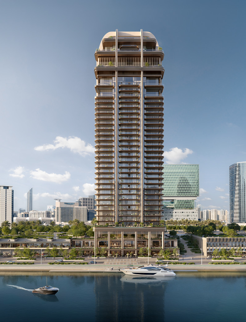 The slender tower rising beside the water with yachts in front