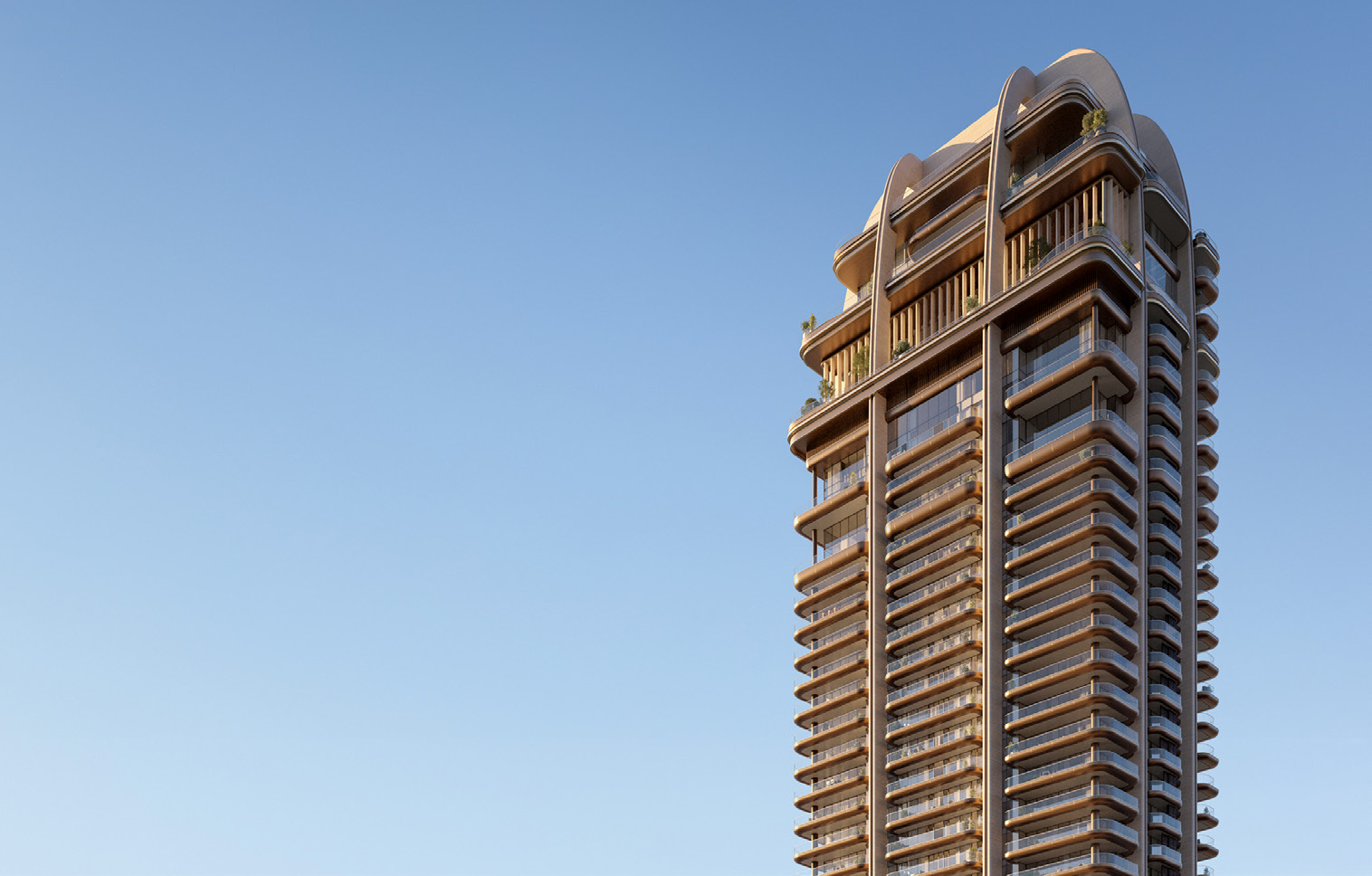 Tower's curved crown and balconies against a clear evening sky