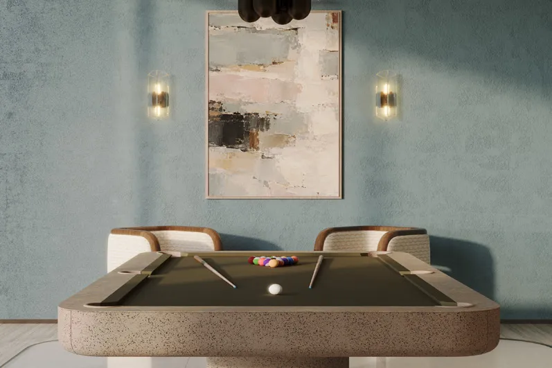 Games room with stone pool table under a bronze pendant light